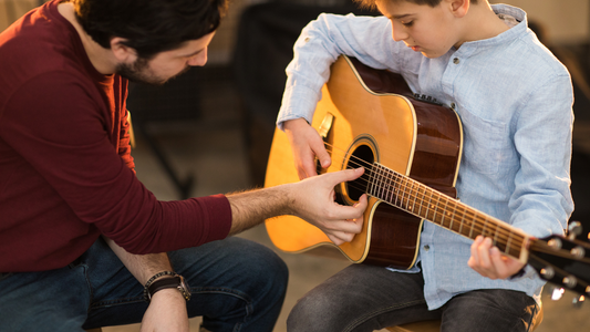 Guitar Teacher and student